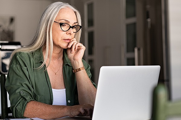 Woman at home working on her laptop