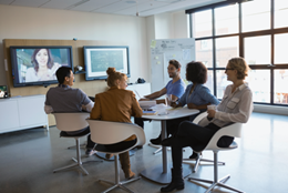 Business people collaborating in a conference call with people working remote